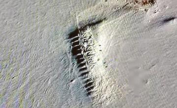 Google Earth investigator sparks Antarctica mystery as he spots secret 'town' unearthed by melting ice