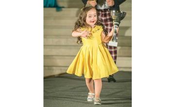 4-year-old girl with Down syndrome warms hearts as she walks in fashion show