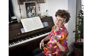 FRENCH LADY HAS BEEN PLAYING PIANO FOR MORE THAN 100 YEARS