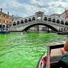 VENICE’S GRAND CANAL TURNS PHOSPHORESCENT GREEN