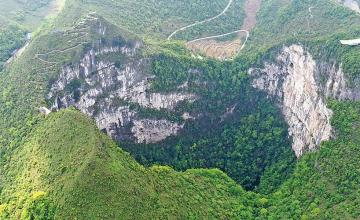 SCIENTISTS DISCOVER AN ANCIENT FOREST INSIDE A GIANT SINKHOLE IN CHINA